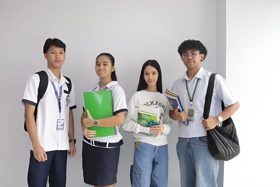 Students with books and school supplies representing the Educational Loan program