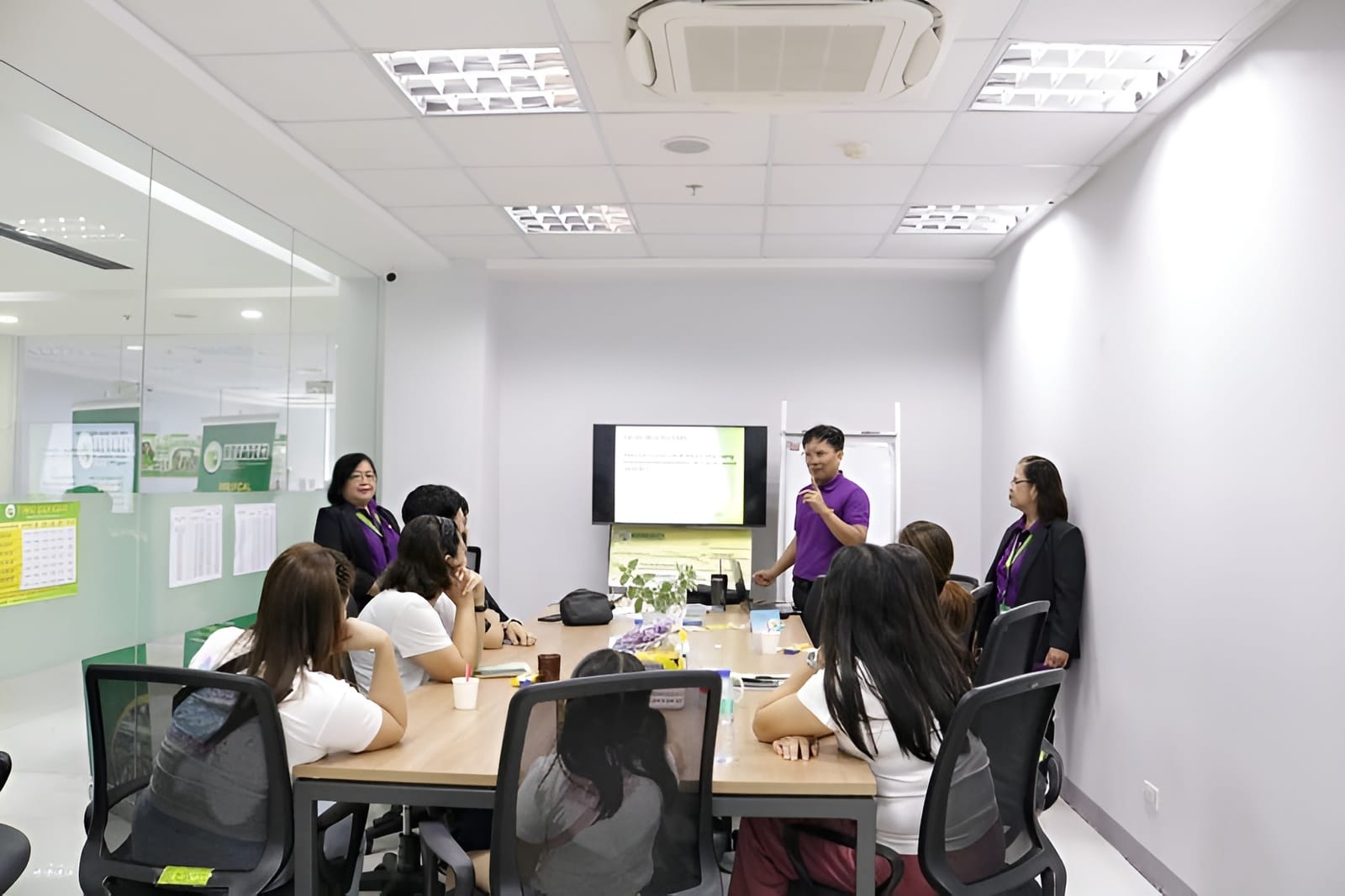 NOVADECI staff leading a member training session in a conference room