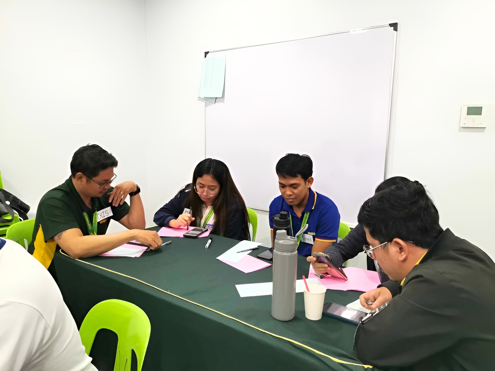NOVADECI employees working together during a workshop