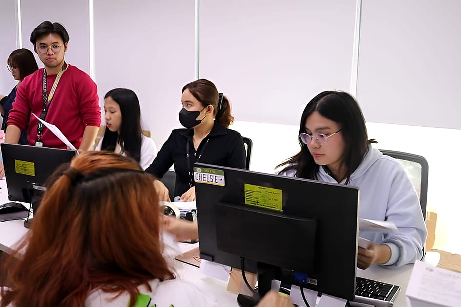 NOVADECI staff assisting members with cooperative loan services