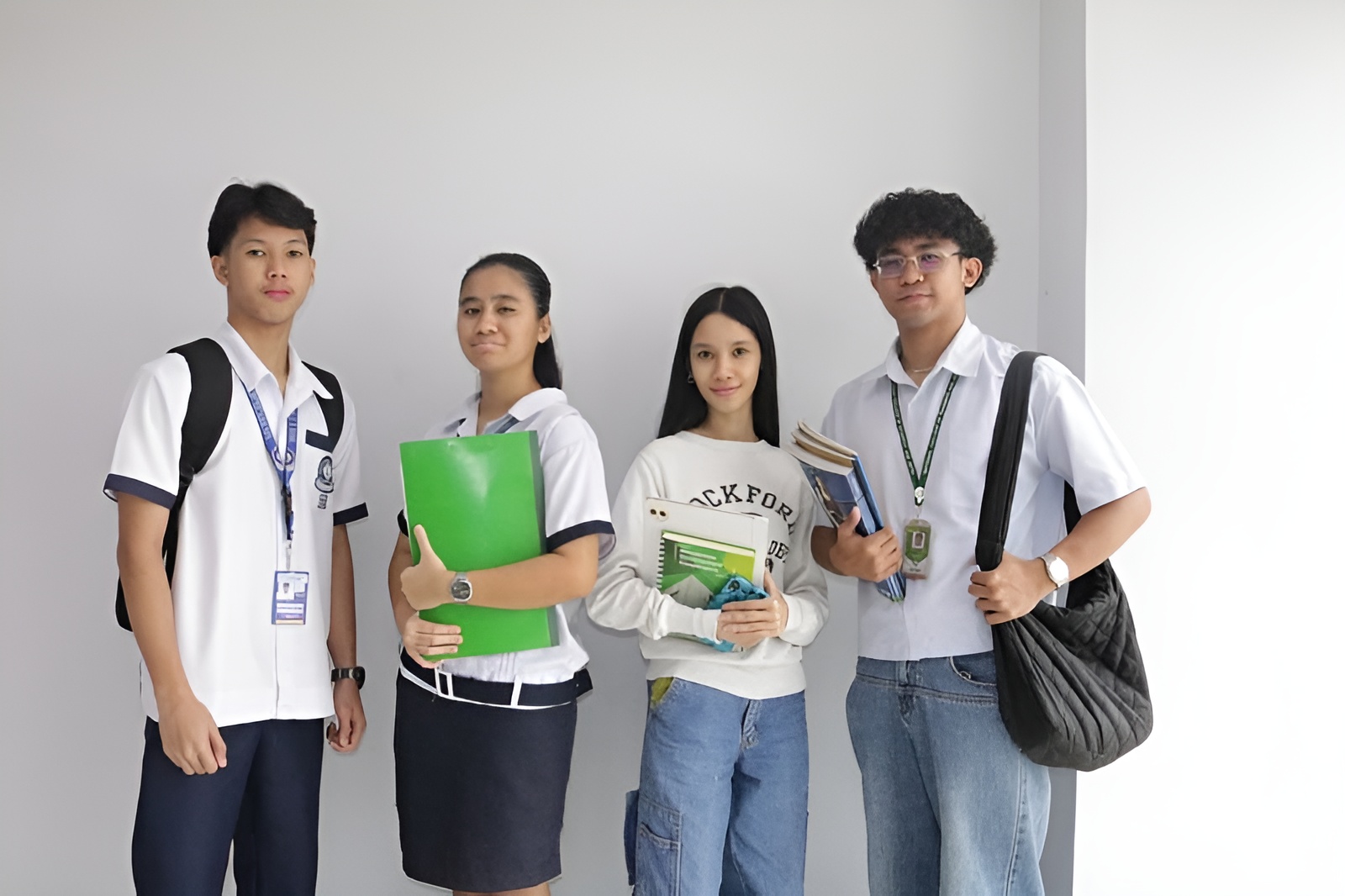 Students with books and school supplies representing the Educational Loan program
